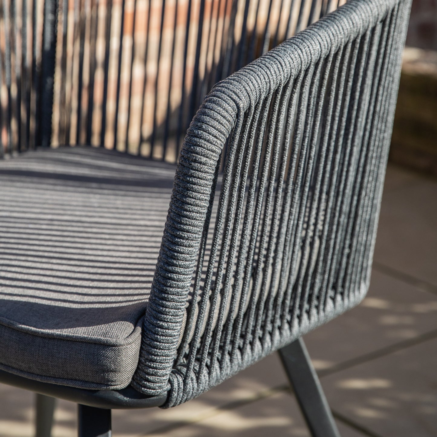 Gallery Garden Cassis 2 Seater Bistro / Tea Set features 2 armchairs with a rounded open rope weave design, a powder coated aluminium frame and a grey seat cushion