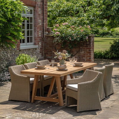 Gallery Garden Chatsworth Rectangular Dining Table crafted with richly grained teak wood and featuring a trestle style base, this table can easily accommodate 6-8 people