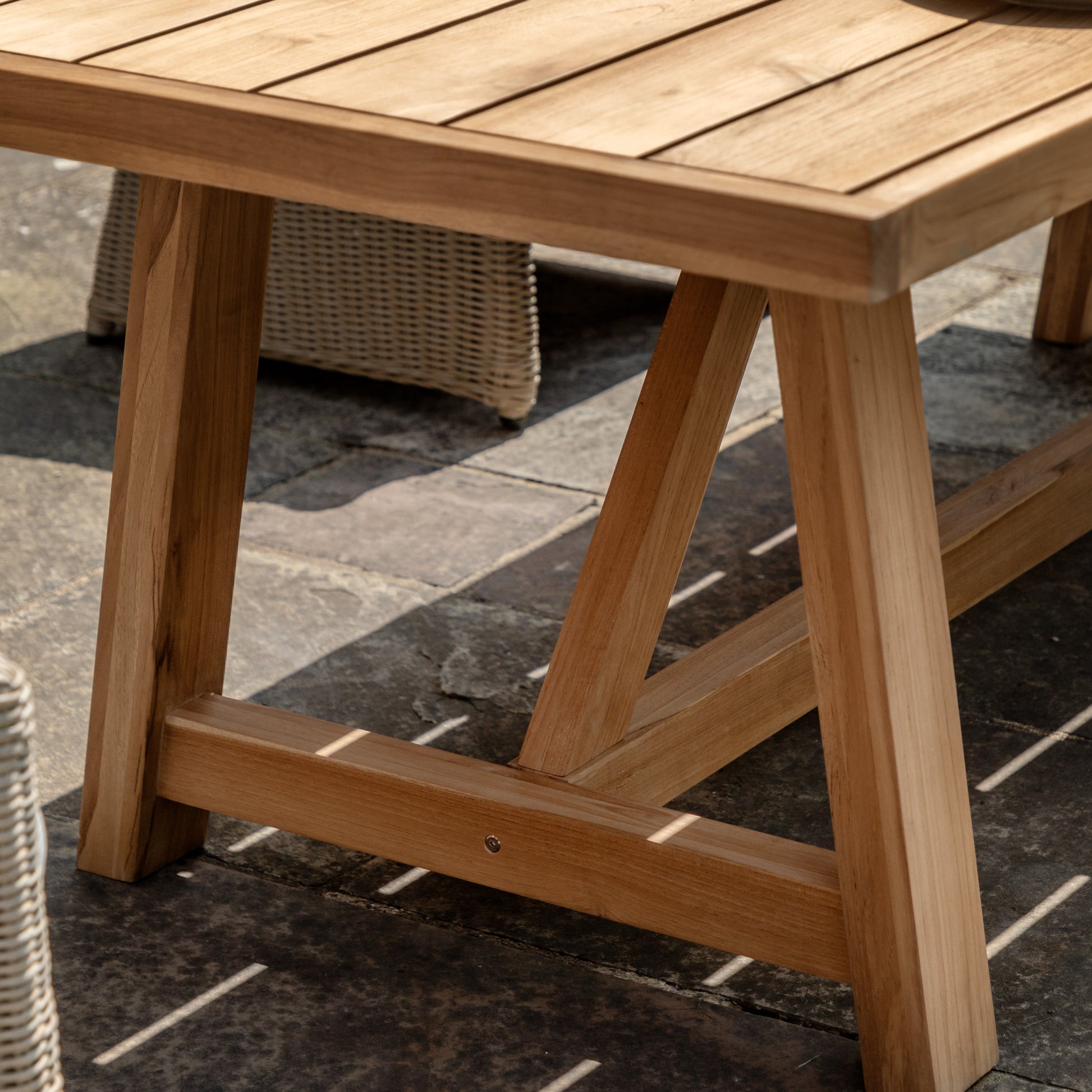 Gallery Garden Chatsworth Dining Table constructed from a premium teak wood with rectangular table top and a trestle style base