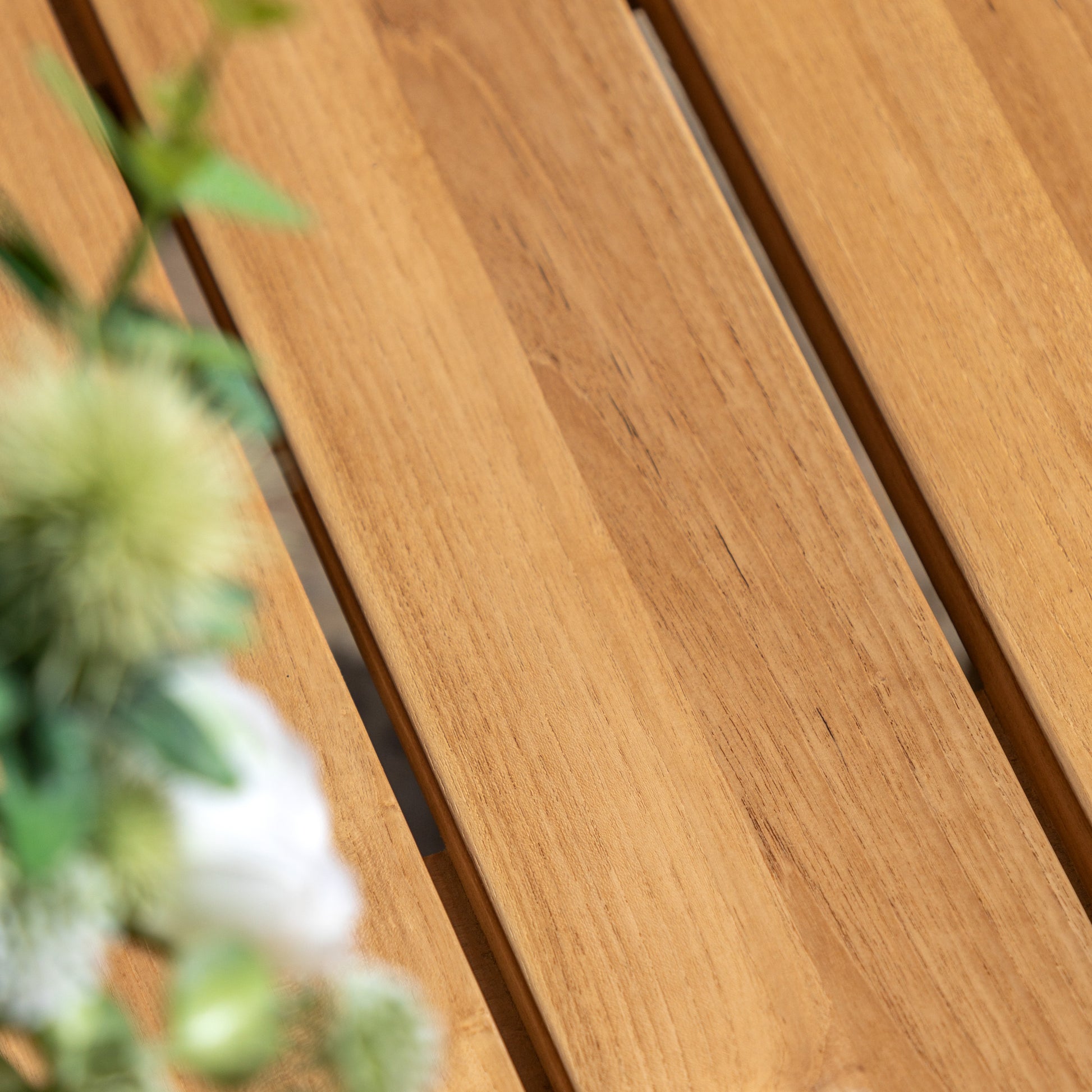 Gallery Garden Chatsworth Round Dining Table with a grooved teak wood table top