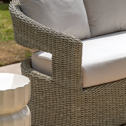 Gallery Garden Hvar 3 Seater Sofa features a grey toned, curved wicker frame with cut-out backrest and natural coloured padded seat and back cushions