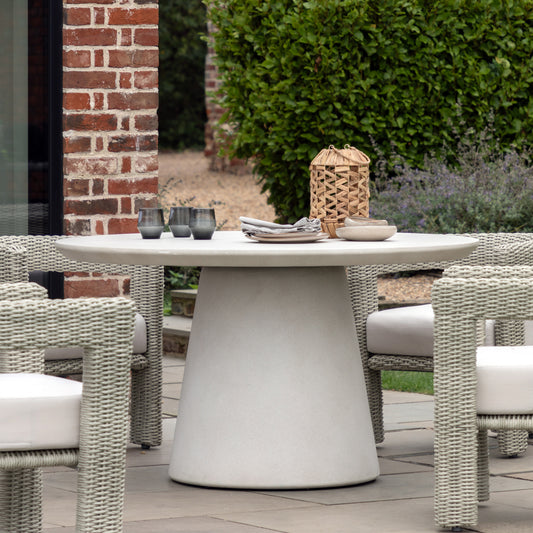 Gallery Garden Hvar Round 4 Seater Dining Table made from GRC with a softly textured concrete-effect finish and a circular pedestal base