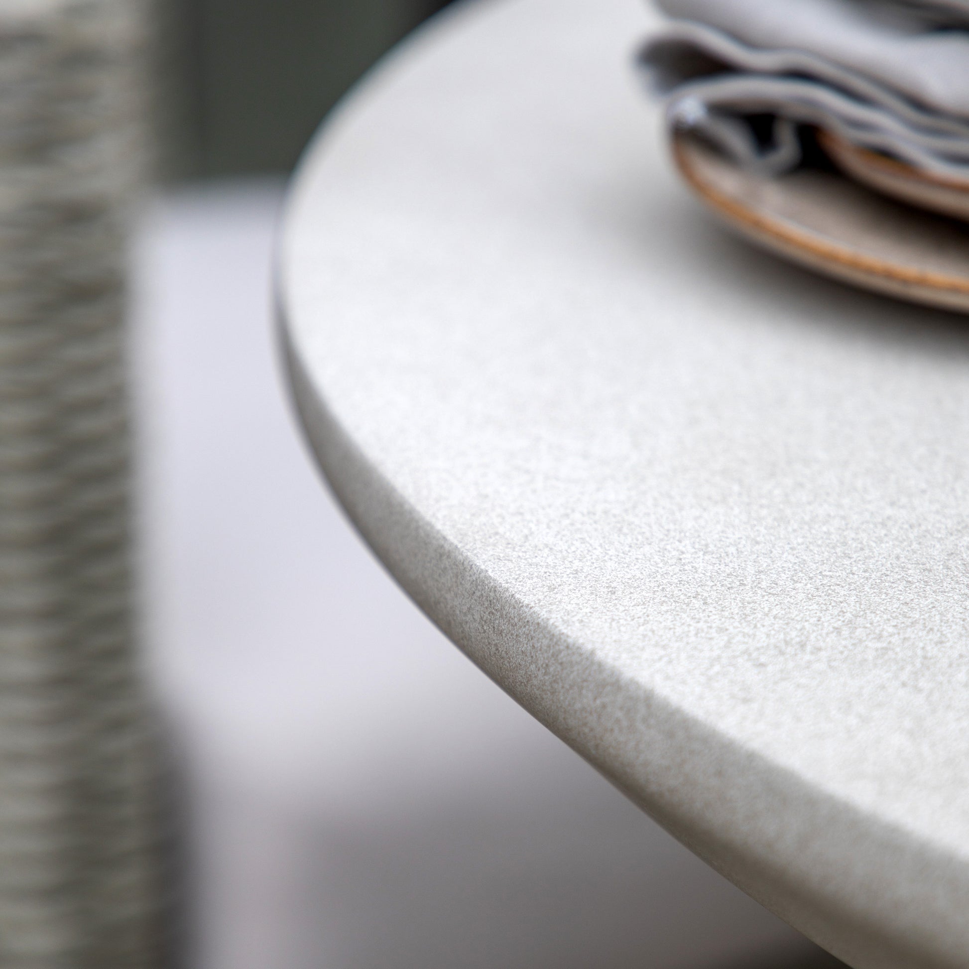 Gallery Garden Hvar Dining Table is a round table for 4 people made from GRC with a concrete-effect finish