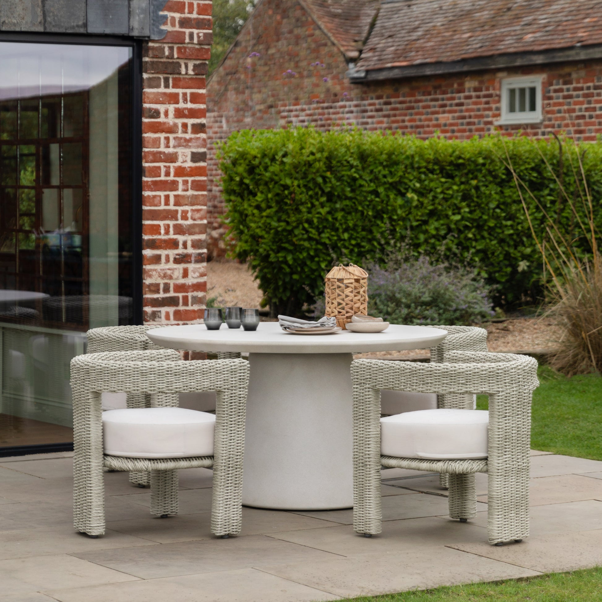 Gallery Garden Hvar 4 Seater Dining Table is constructed from glass reinforced concrete with a round table top and pedestal base. Matching chairs are available separately