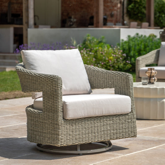 Gallery Garden Hvar Swivel Chair features a rounded wicker frame with a swivel base, and generously padded seat and backrest cushions