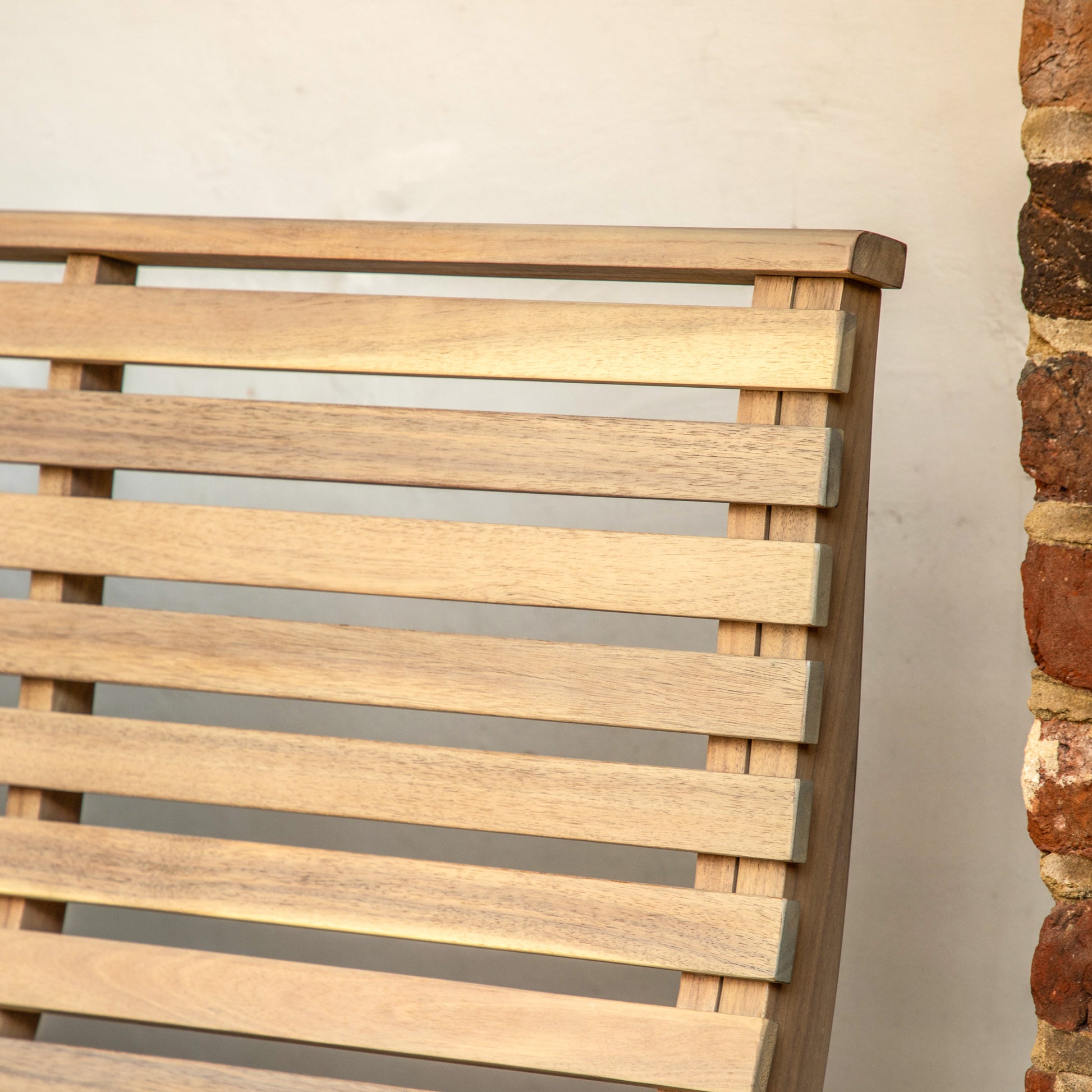 Gallery Garden Kalamata Bench features a natural acacia slatted wood design