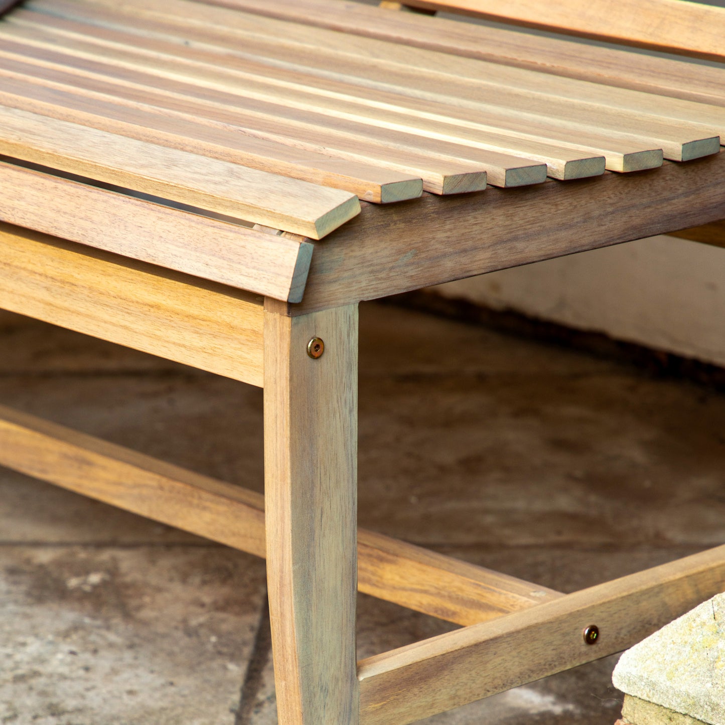 Gallery Garden Kalamata Bench features a gently curved design, crafted from natural slatted acacia wood