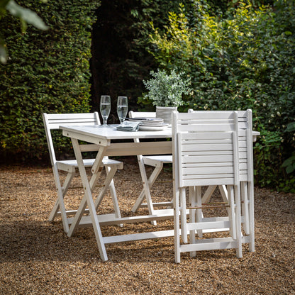Gallery Garden Lindos Dining Set in White features a table with slatted top and 4 chairs, all can be folded for easy storage