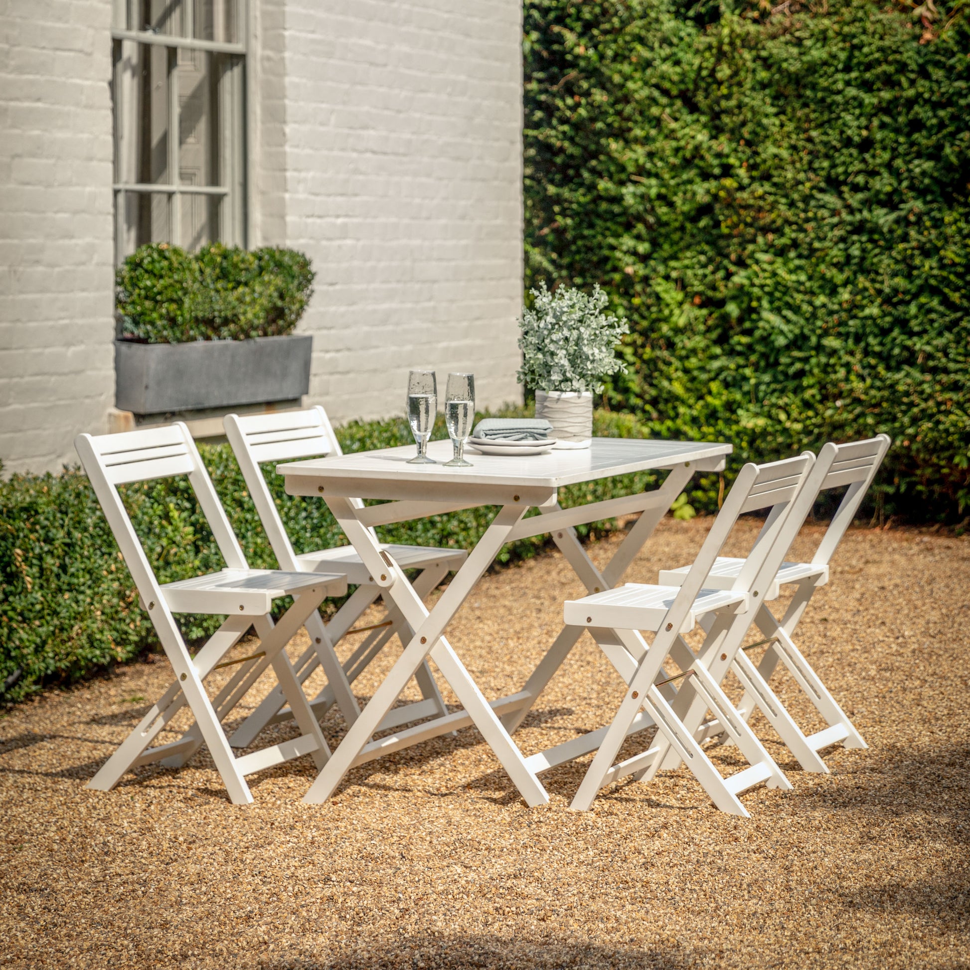 Gallery Garden Lindos Foldaway Dining Set in White painted acacia wood, with 4 chairs and a slatted table 