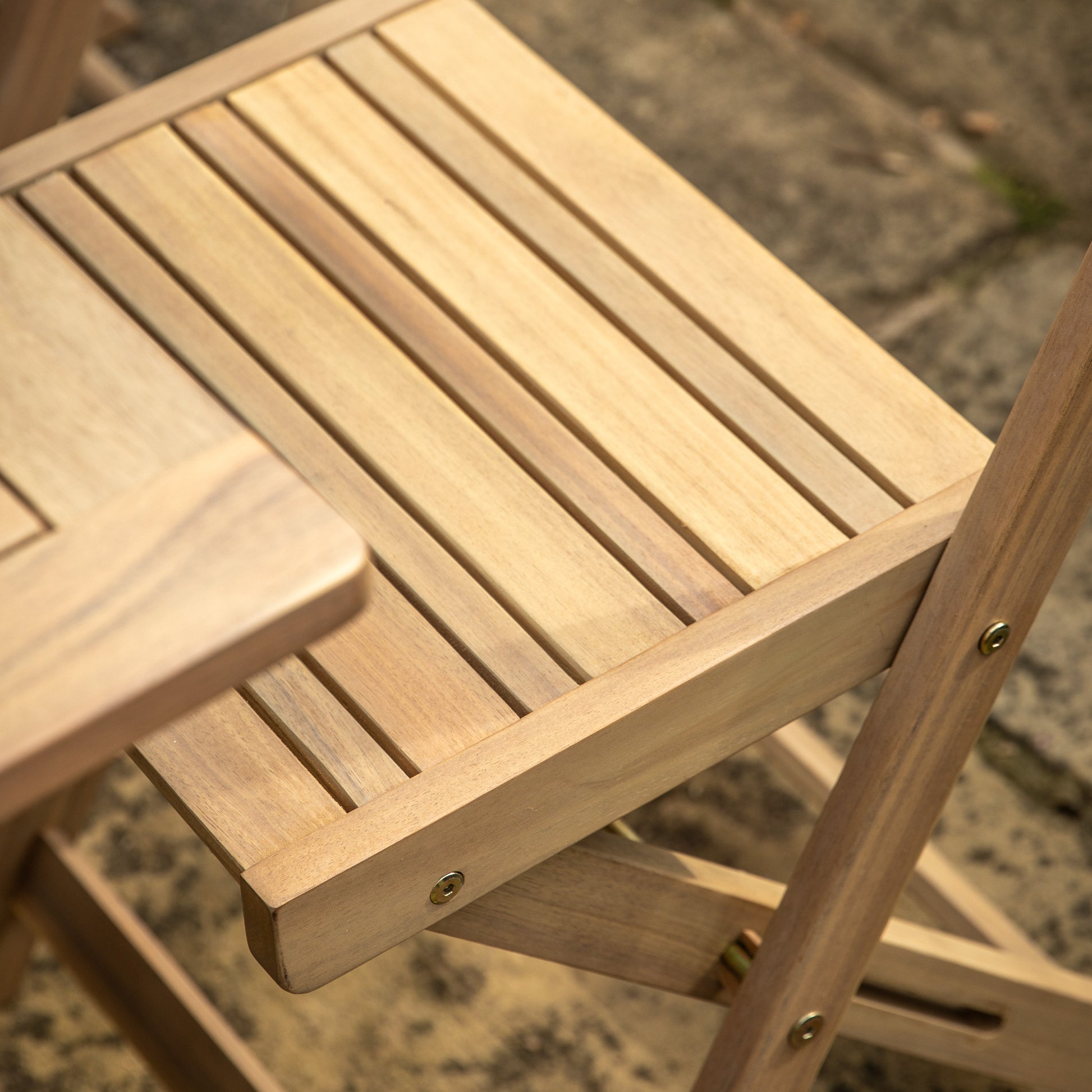 Gallery Garden Lindos Folding Dining Set in Natural acacia wood with a slatted top table and 4 chairs with slatted seat and rope detail backrest