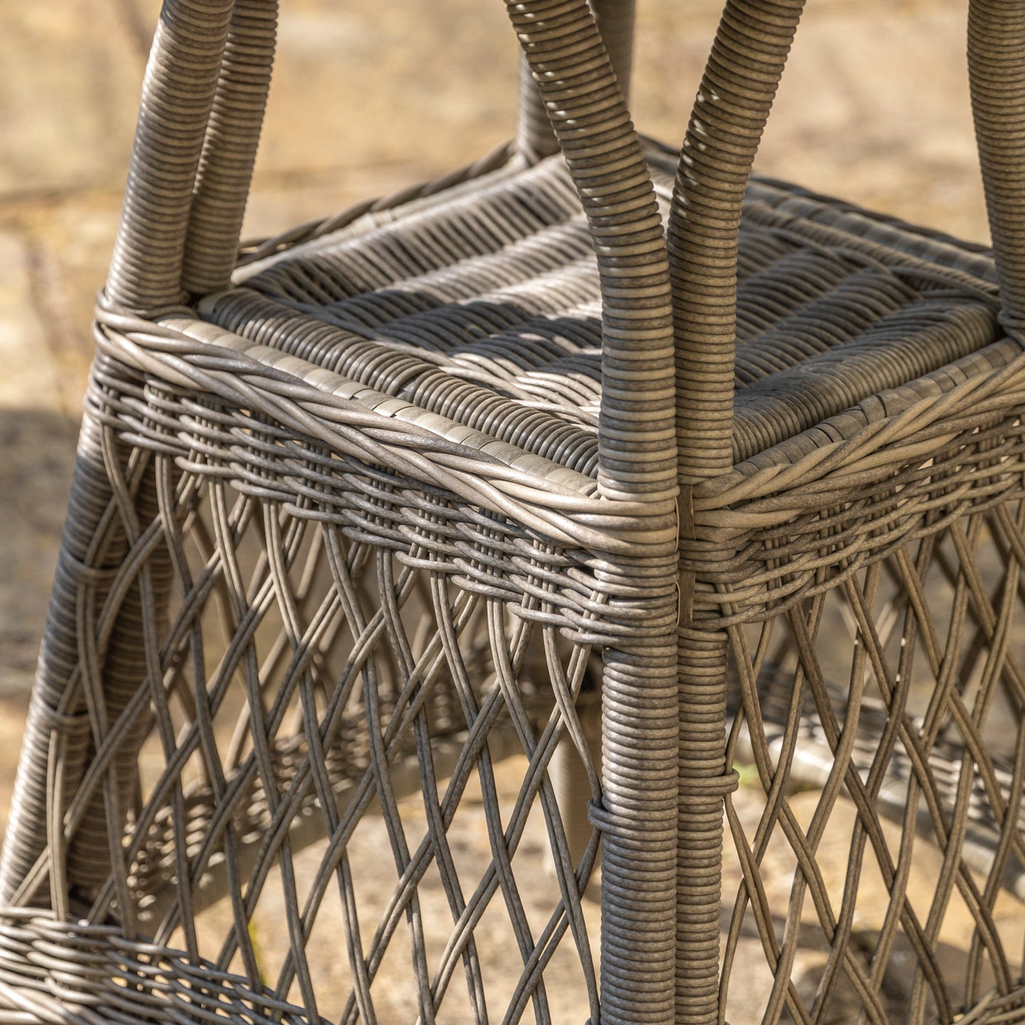 Gallery Garden Menton Bistro Set in Stone coloured PE rattan, features a small table with a glass table top and underneath shelf