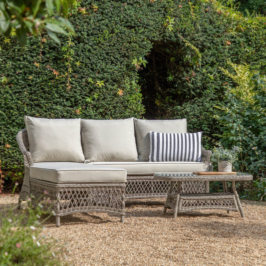 Gallery Garden Menton Chaise 3 Seater Set in a Stone coloured PE rattan with generously padded cushions, and a matching rattan coffee table with glass table top