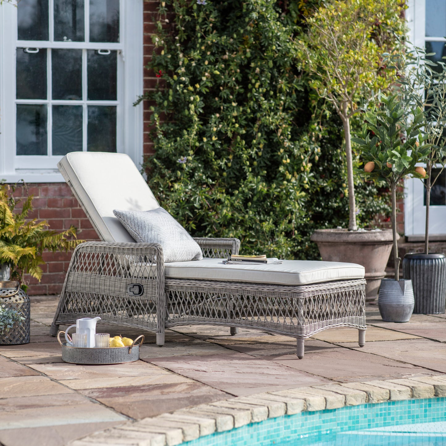 Gallery Garden Menton Country Recliner Lounger constructed from a PE wicker in a Stone colour with generously padded cushions