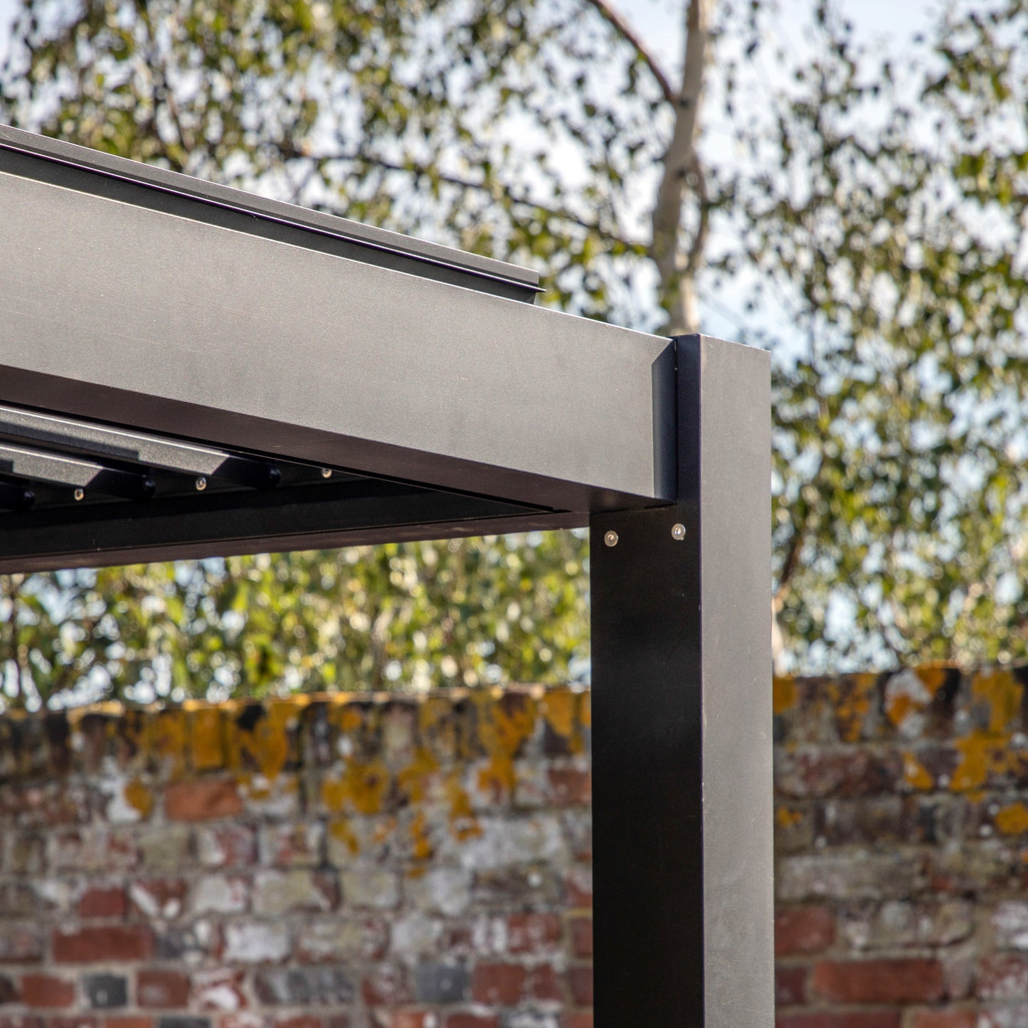 Gallery Garden Black Aluminium Messina Pergola with an adjustable louvred roof system and integrated drainage channels