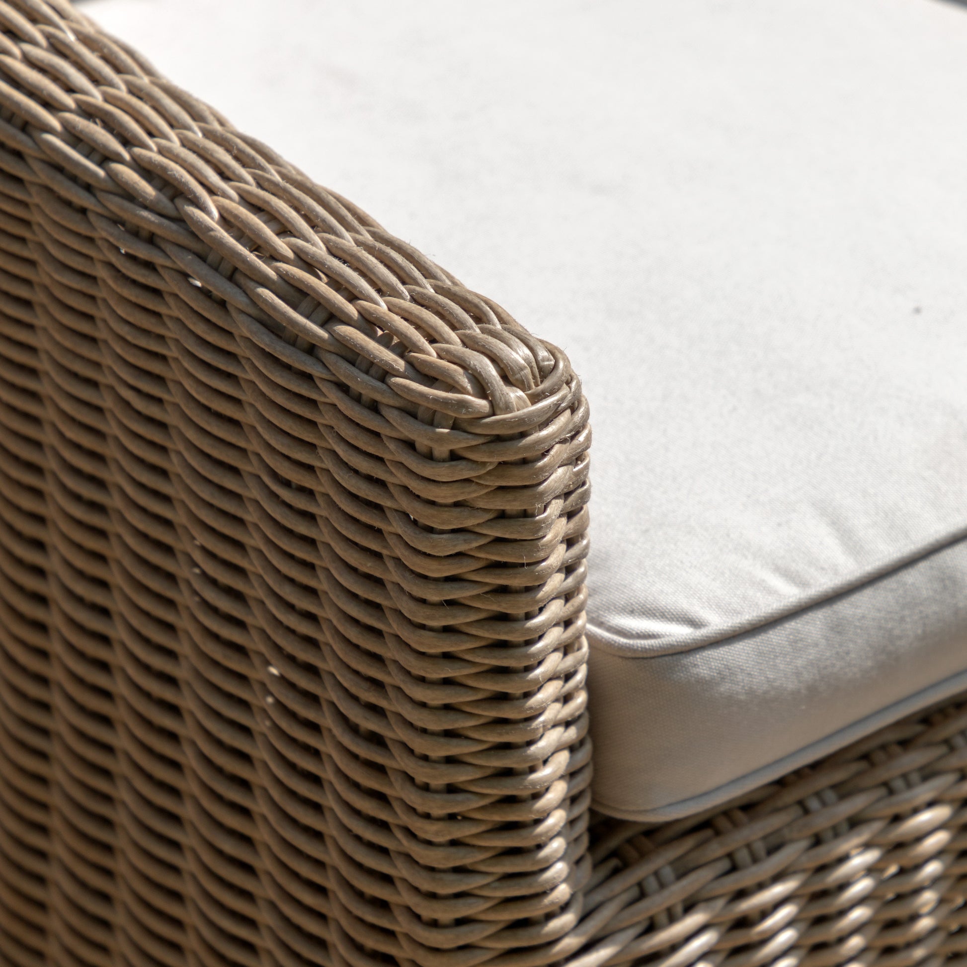 Gallery Garden Pair of Chatsworth Dining Chairs are crafted from a durable woven plastic wicker with gently sloping arms and a padded seat cushion