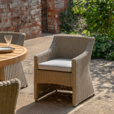 Gallery Garden Pair of Chatsworth Dining Chairs made from durable and weather resistant plastic wicker, with a ergonomic design and natural coloured seat cushions