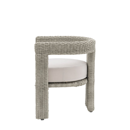 Gallery Garden Pair of Hvar Dining Chairs made from grey toned wicker with a curved architectural frame and deep filled seat cushion