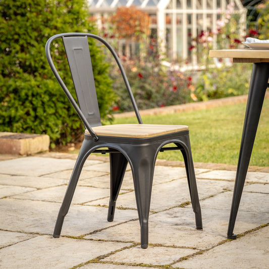 Gallery Garden Pair of Ponza Dining Chairs in Black metal with a natural acacia wood seat for an industrial contemporary look and feel