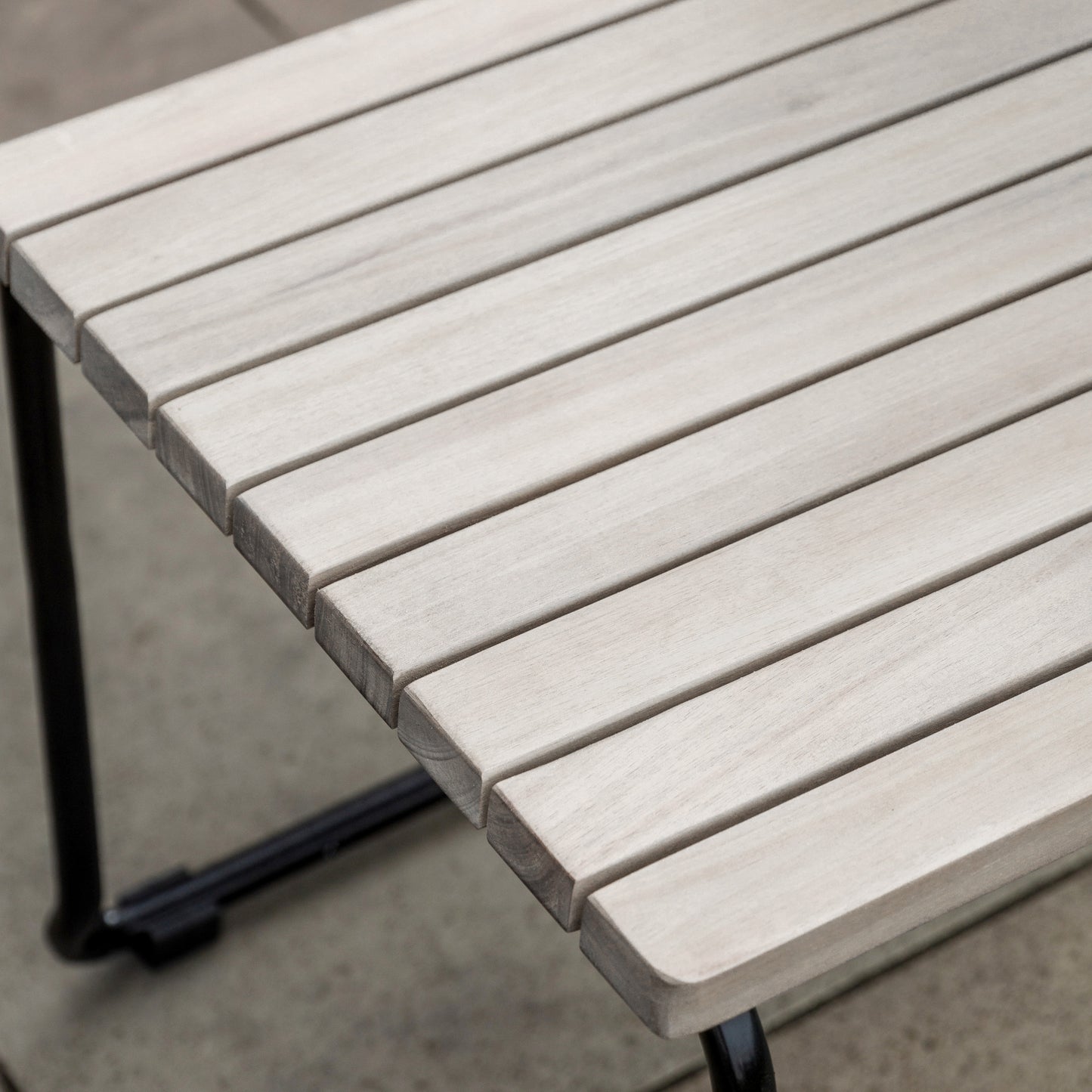 Gallery Garden Pair of Taranto Dining Chairs constructed from grey toned acacia slatted wood and black metal