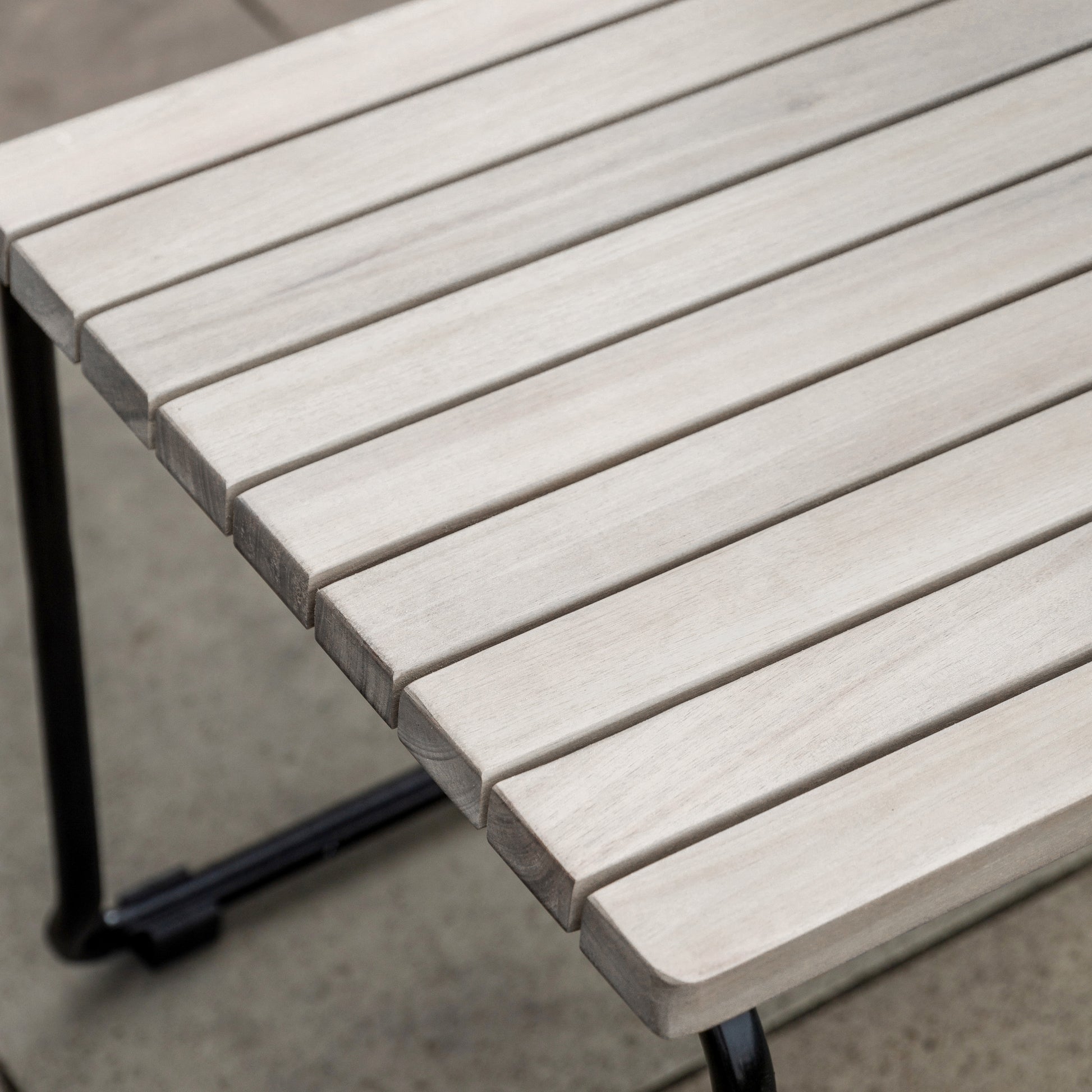 Gallery Garden Pair of Taranto Dining Chairs constructed from grey toned acacia slatted wood and black metal