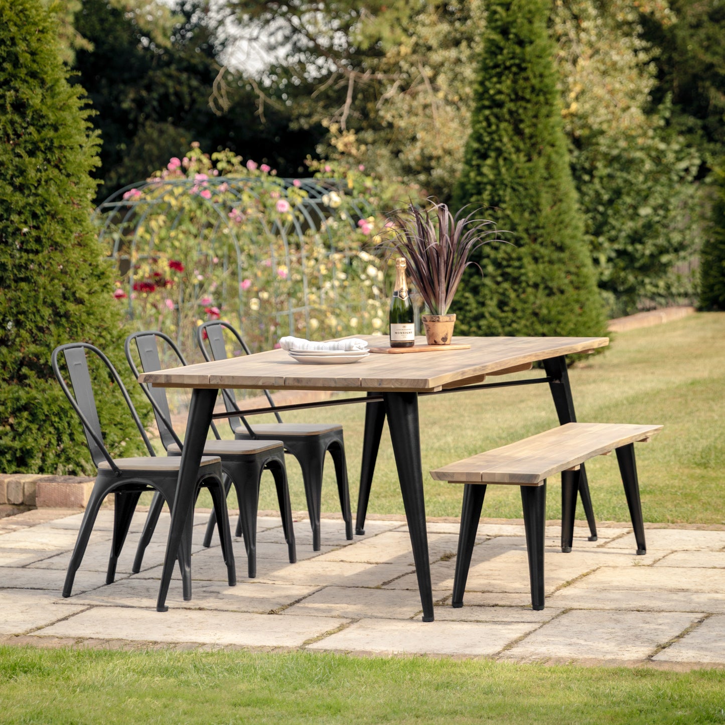 Gallery Garden Ponza 6 Seater Rectangular Dining Table constructed from a premium acacia wood with a warm, natural finish, and dark powder coated metal legs