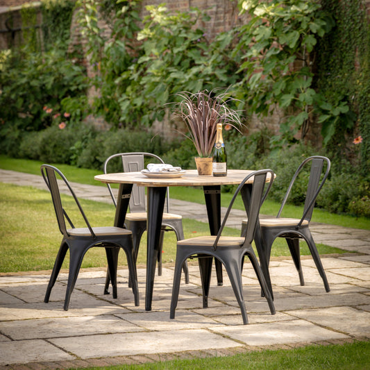 Gallery Garden Ponza 4 Seater Round Dining Table is constructed using premium acacia wood with a warm, natural finish and bold, dark powder coated metal legs