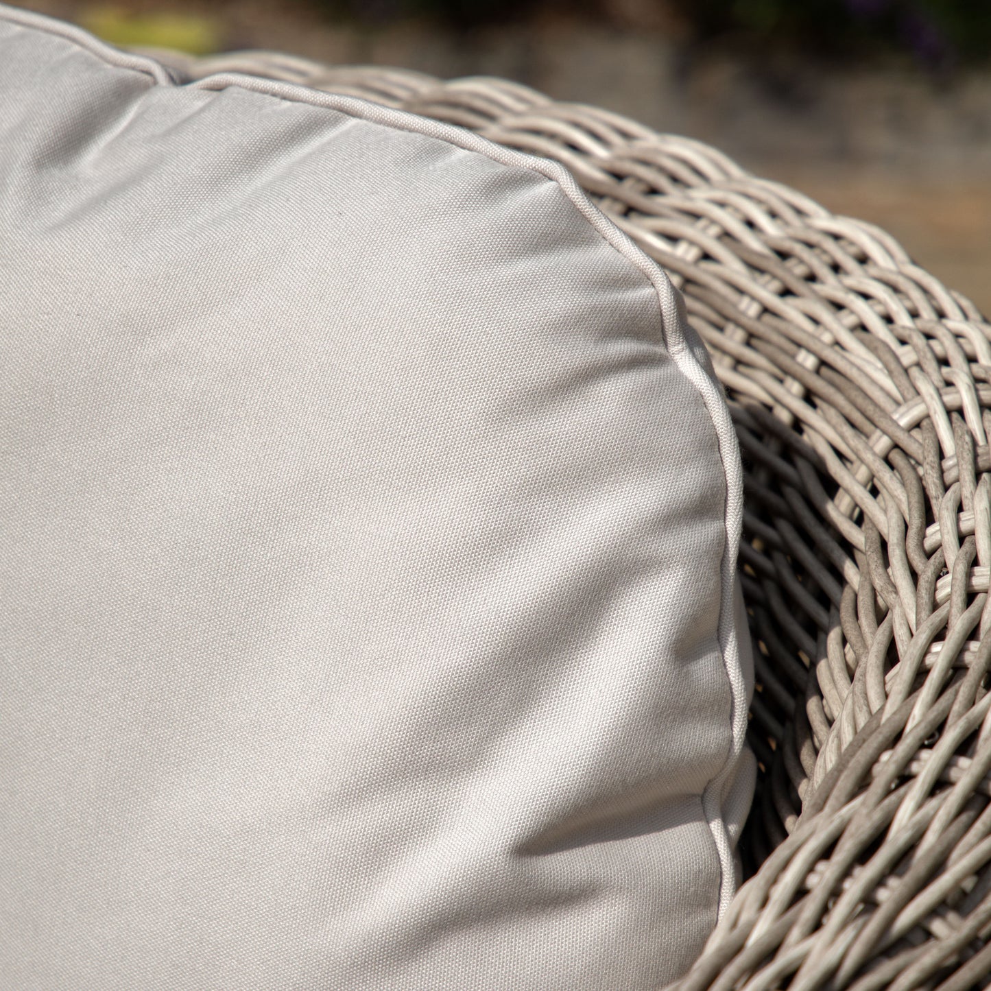 Gallery Garden Positano Armchair is constructed from a woven plastic wicker, with generously padded cushions in a natural colour