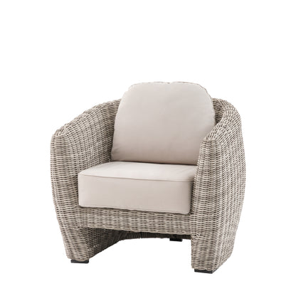 Gallery Garden Positano Armchair features a curved woven plastic wicker frame and generously filled seat cushions