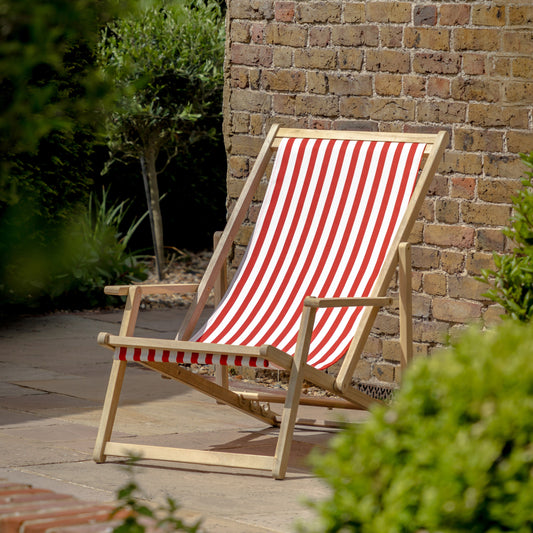 The Gallery Garden Deck Chair features an acacia wood frame with a red and white stripe fabric seat, and also has 3 recline positions