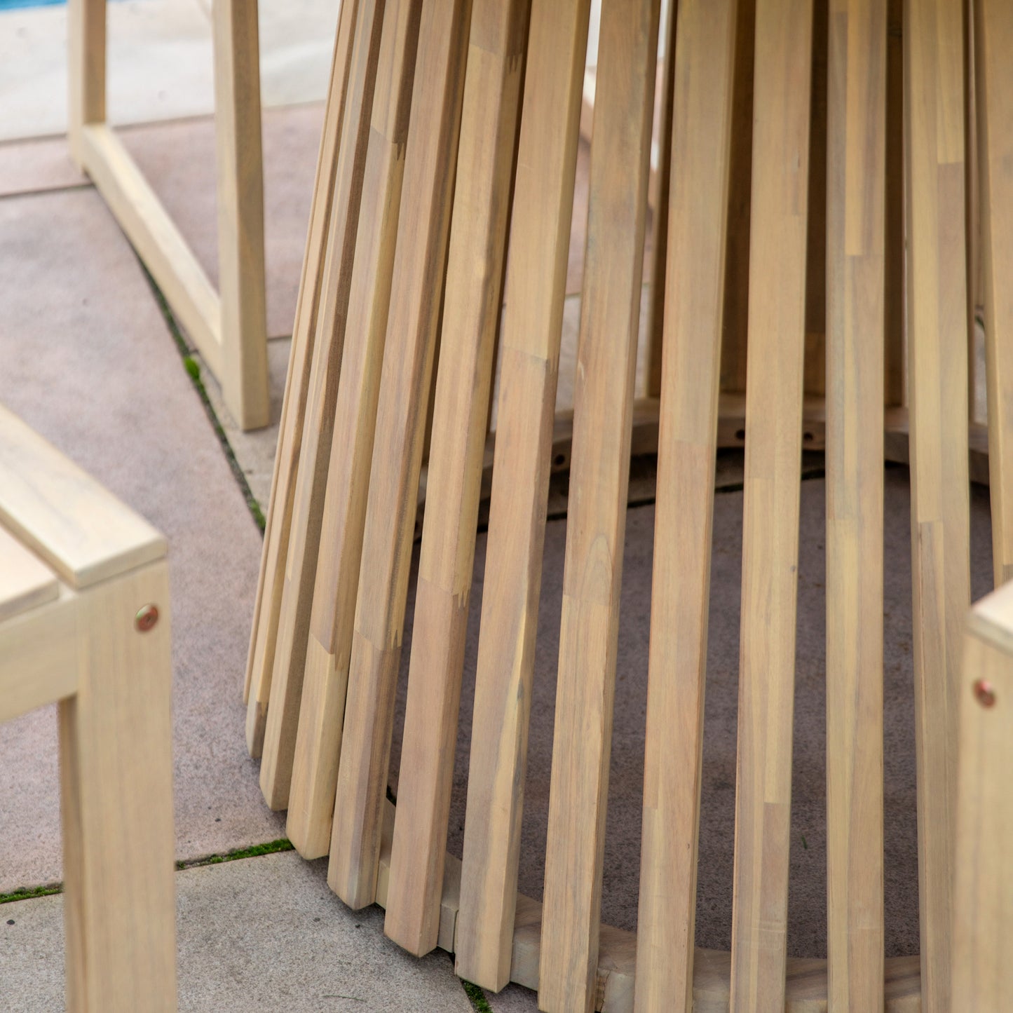 Gallery Garden Rialto Round 4 Seater Dining Table is constructed from natural acacia wood with a circular slatted base