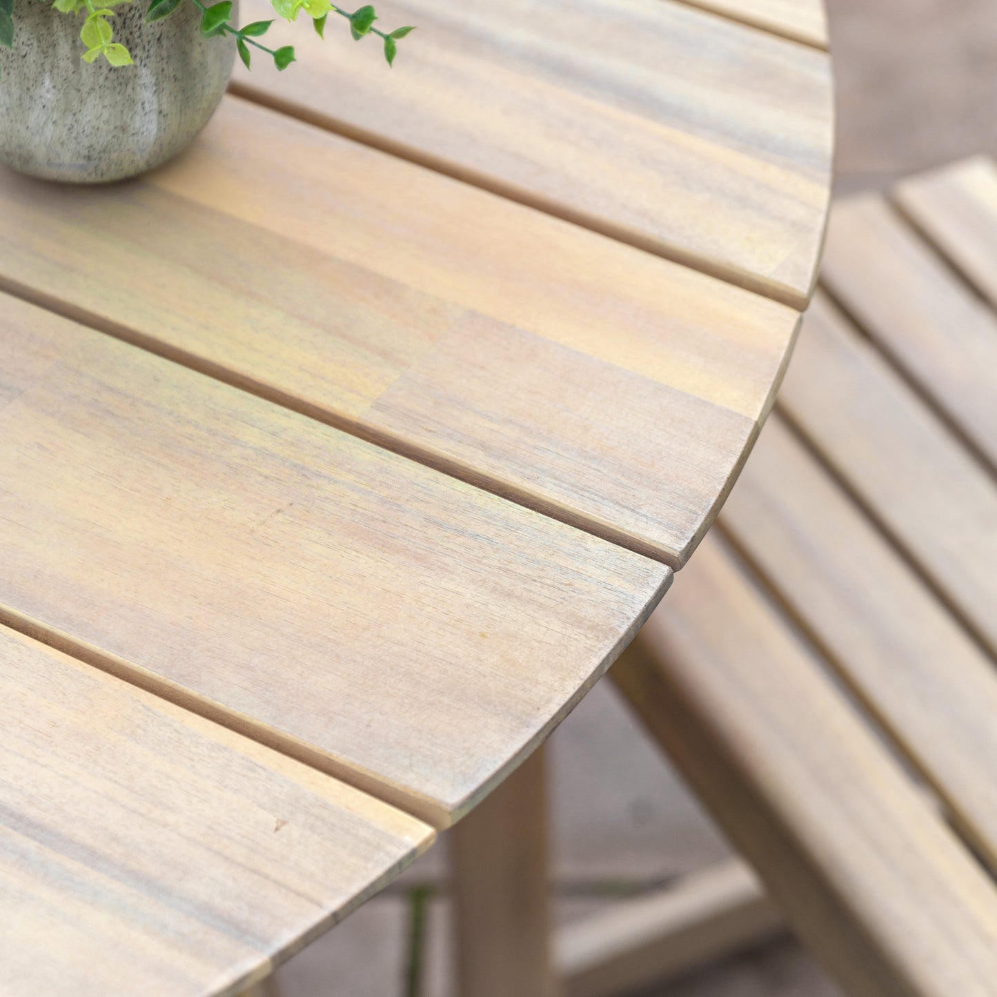 Gallery Garden Rialto Round Dining Table features a slatted acacia wood table top and base