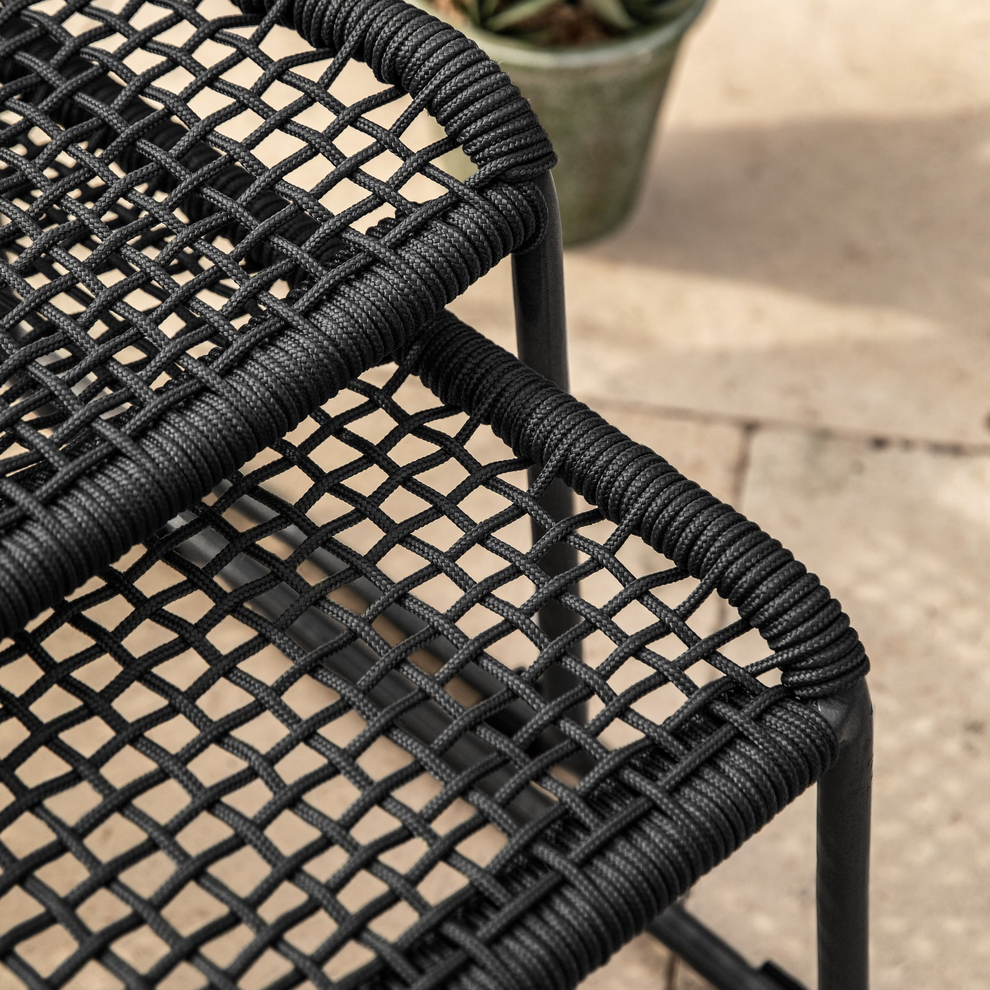 Gallery Garden Sassano Lounge Chair with Footstool has a Black steel frame and woven rope seat