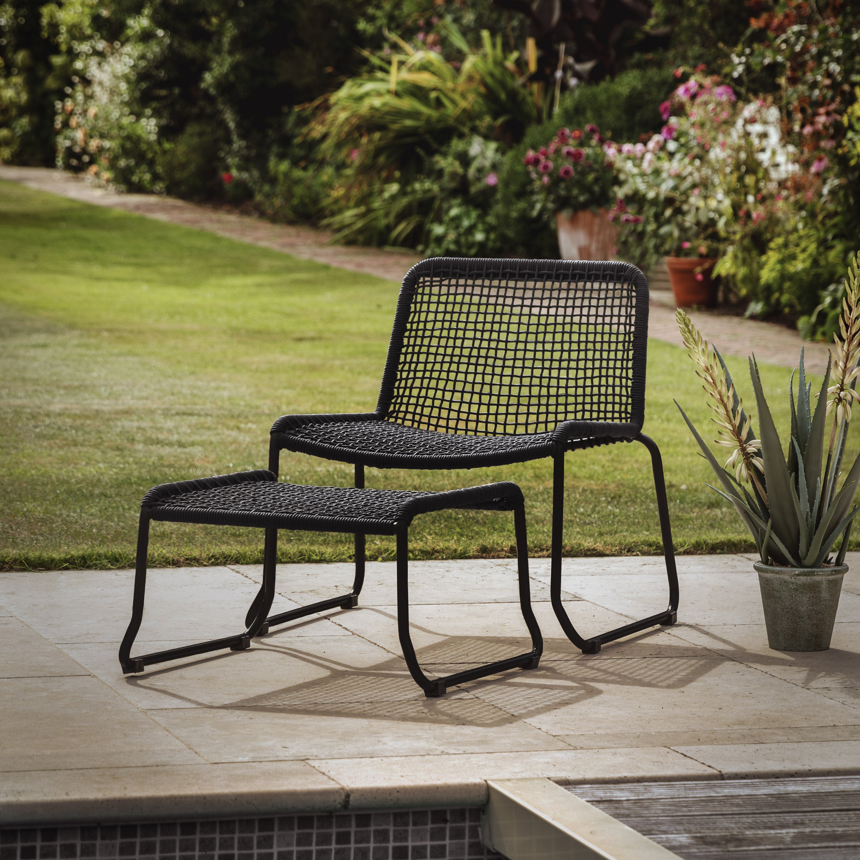 Gallery Garden Sassano Black Lounge Chair and Footstool with a robust steel frame and rope woven seat 