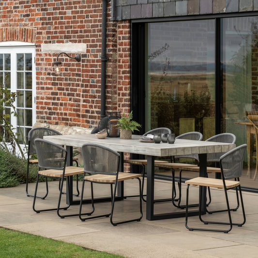 Gallery Garden Taranto Dining Table crafted from grey acacia wood and black iron legs, features a slatted table top that can seat up to 8 people. Chairs available separately 