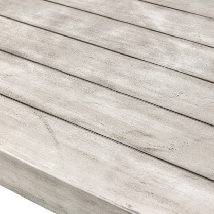 Gallery Garden Taranto Dining Table 6 Seater is constructed from grey acacia with a slatted wood top