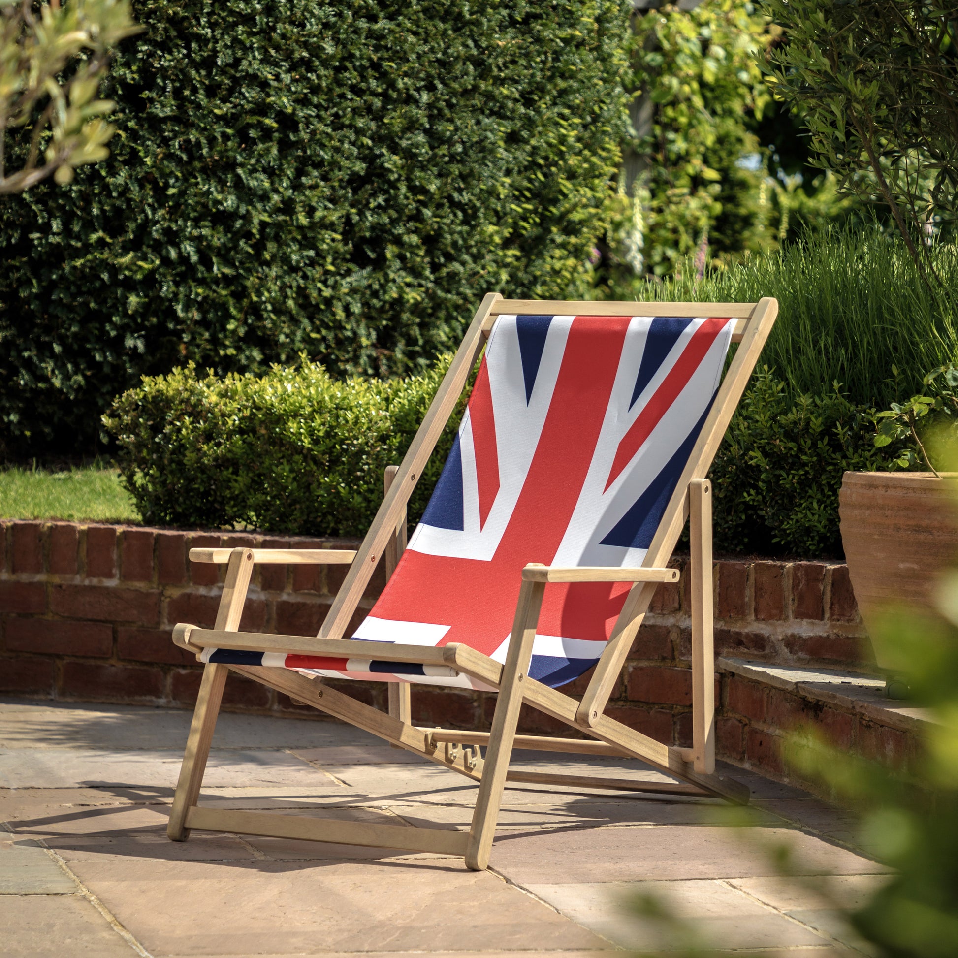Gallery Garden Deck Chair made from a lightweight but durable acacia wood frame and union jack fabric seat, featuring 3 reclining positions and integrated armrests