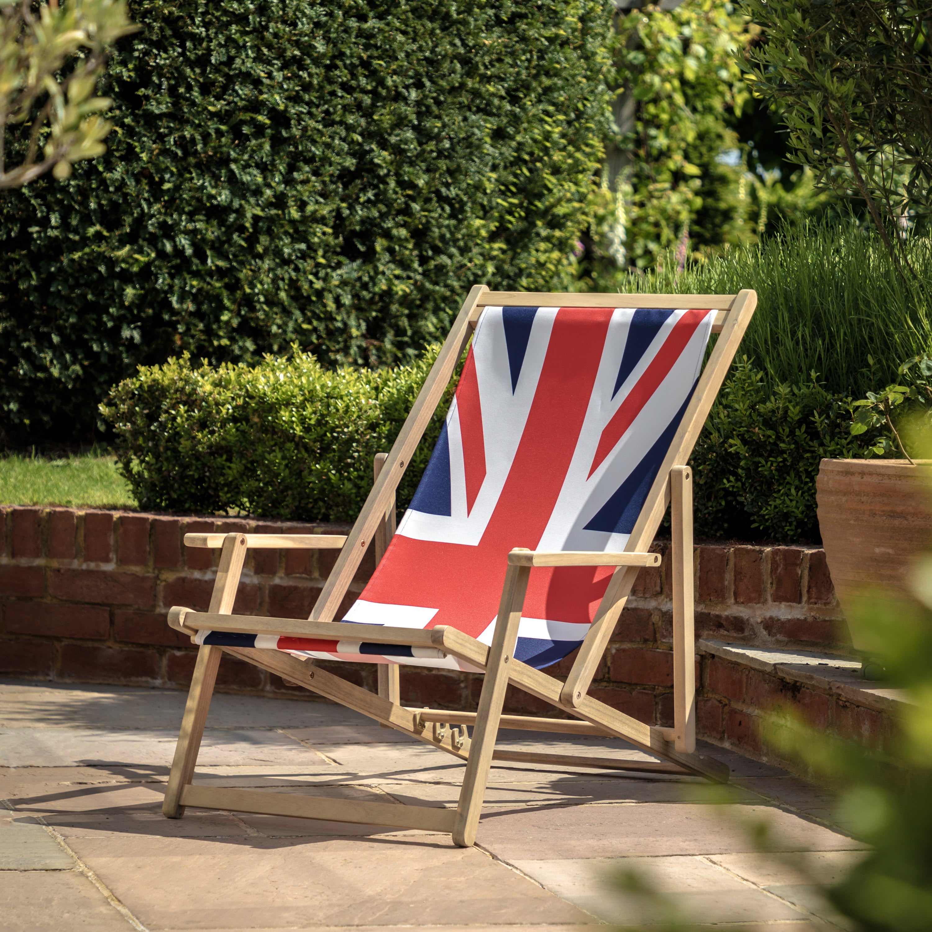 Gallery Garden Deck Chair made from a lightweight but durable acacia wood frame and union jack fabric seat, featuring 3 reclining positions and integrated armrests