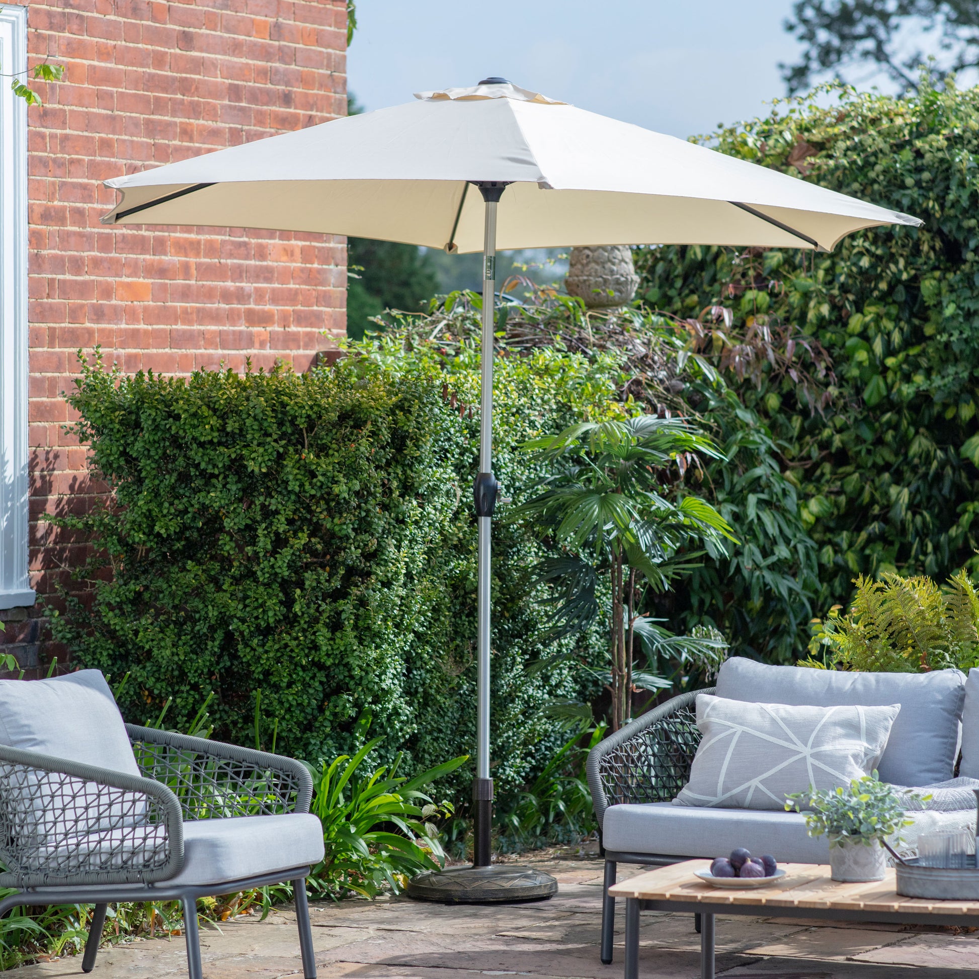Gallery Garden Vazzano 2.7m Parasol in Cream fabric with an aluminium frame and winding handle mechanism