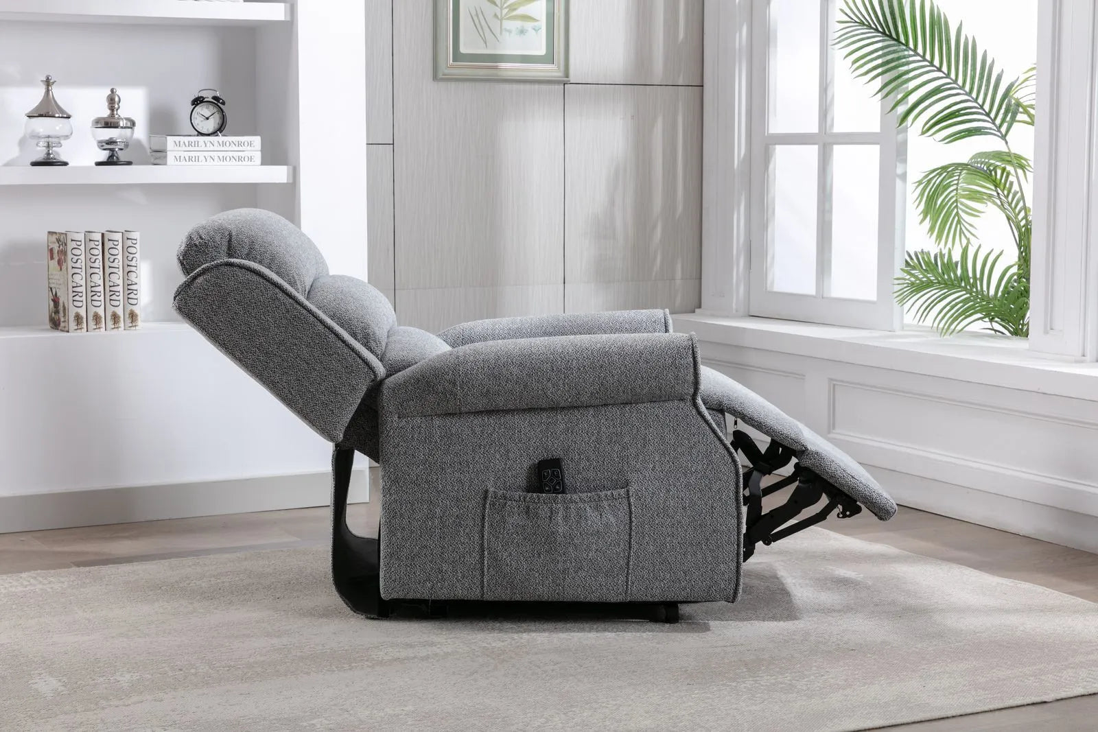 Global Furniture Alliance Andover Dual Motor Riser Recliner Chair in Grey plush tactile fabric with a remote handset to operate the rise, lift and recline functions