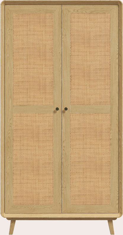 Laura Ashley Millen 2 door wardrobe crafted from solid oak and oak veneer with natural rattan panels, gold coloured handles and mid century styling