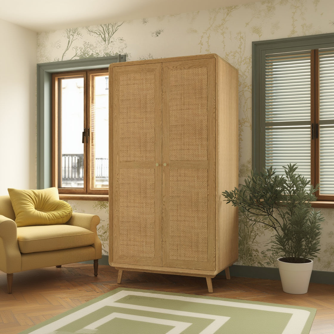 Laura Ashley Millen 2 door oak wood wardrobe with rattan panelled doors, gold coloured handles and modern mid century styling