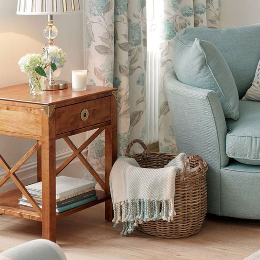 Laura Ashley Balmoral 1 Drawer Side Table in Honey birch wood features cross framed side design, open shelving and 1 storage drawer with brass handle and corner brackets