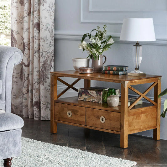 Laura Ashley Balmoral 2 Drawer TV Unit in Honey birch wood with brass hardware, 2 storage drawers, an open shelf and cross-frame side details