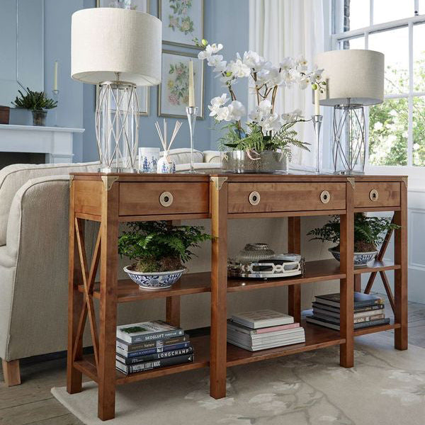 Laura Ashley Balmoral 3 Drawer Triple Console Table in Honey birch wood with 3 storage drawers, 2 shelves, cross frame side detailing and brass hardware