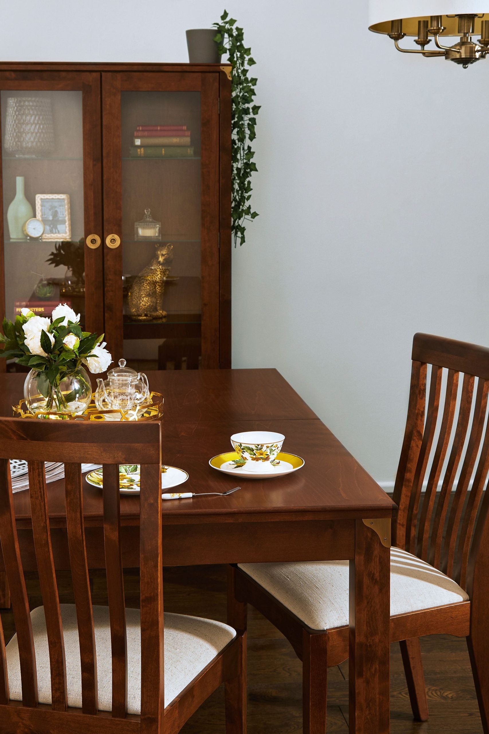 Traditional Laura Ashley Balmoral extendable dining table in chestnut wood with classic straight legs and natural grain detail, can seat 6-8 people