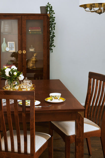 Traditional Laura Ashley Balmoral extendable dining table in chestnut wood with classic straight legs and natural grain detail, can seat 6-8 people