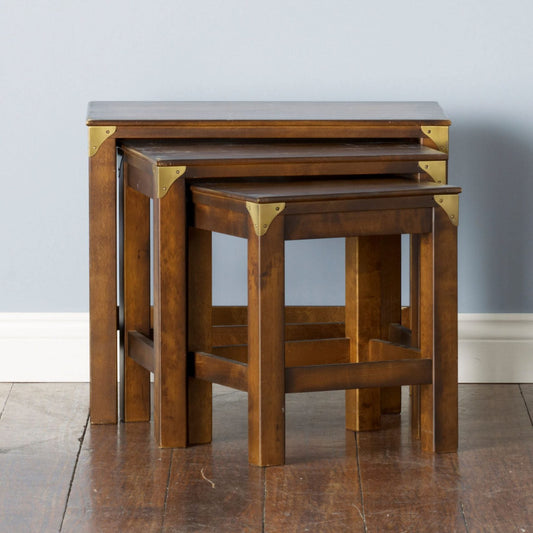 Laura Ashley Balmoral nest of 3 wooden tables featuring a deep chestnut birch finish, sturdy square legs and decorative brass corner detailing.