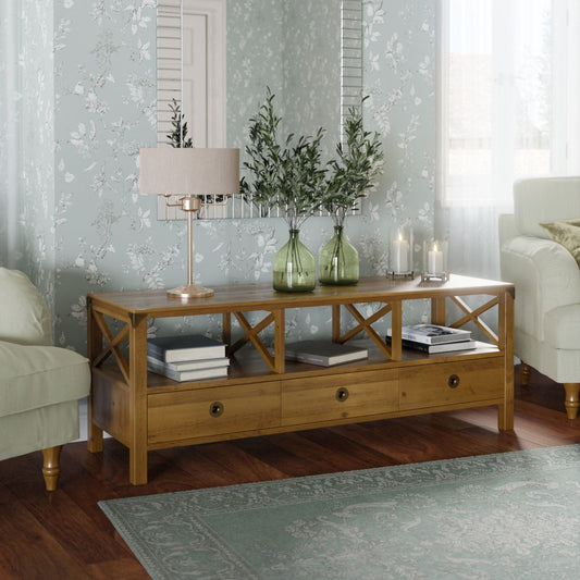 Laura Ashley Balmoral Wide TV Unit in Honey coloured birch wood has a cross framed side design, 3 open shelves above 3 storage drawers with brass effect handles