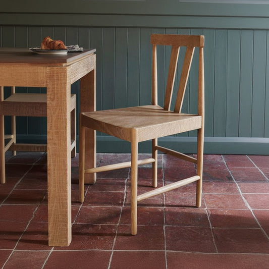 Laura Ashley Braystone pair of solid oak dining chairs with distressed white washed finish, rustic contemporary style