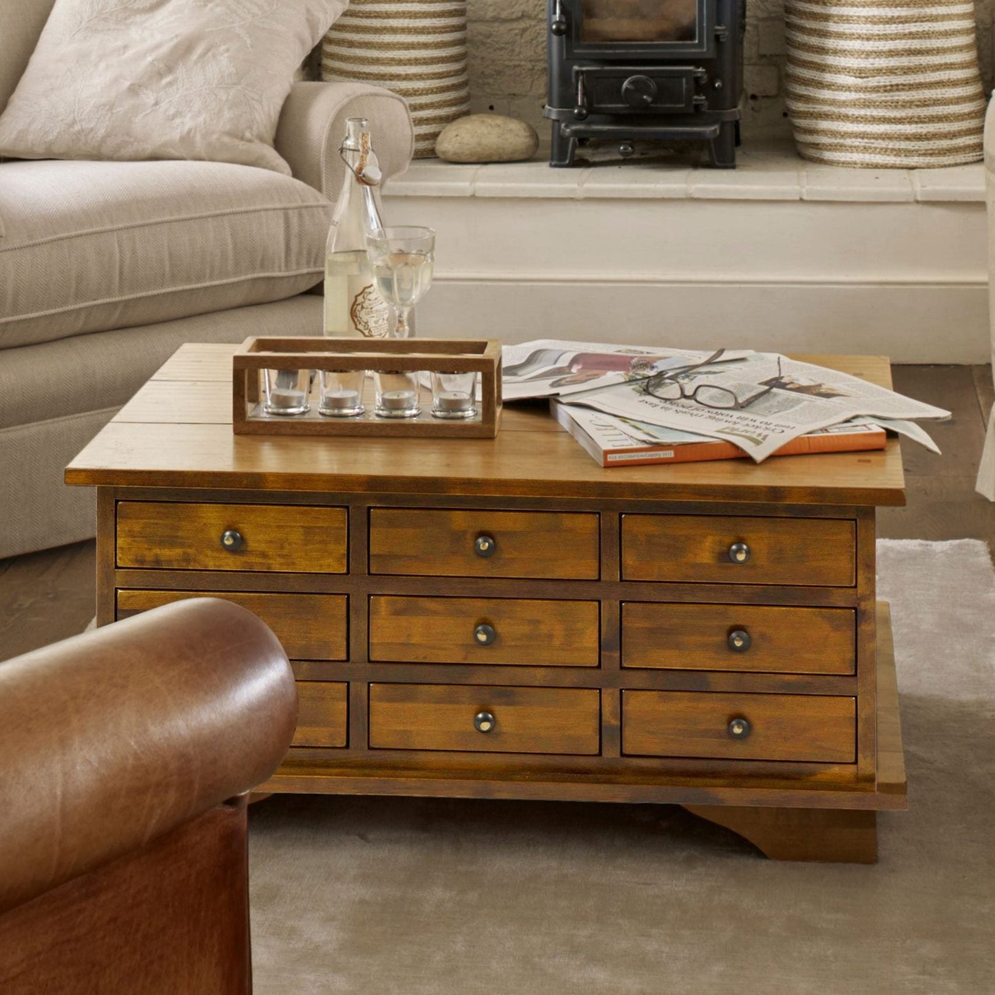 Laura Ashley Garrat chestnut coffee table is ideal for organised living rooms with 9 drawers to the front and lift-up top for extra storage inside